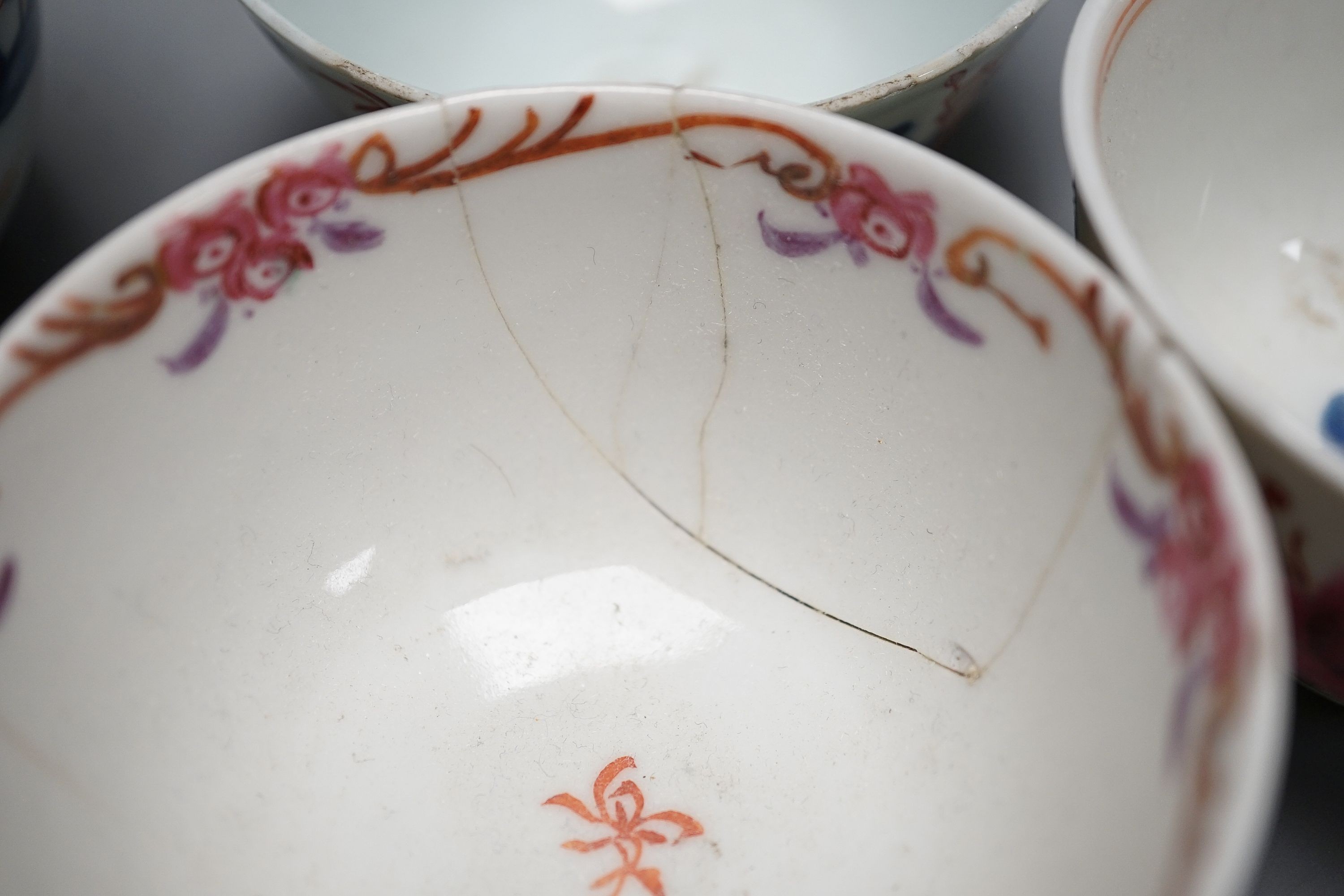 A collection of 18th century Chinese export porcelain tea bowls or cups and two cloisonné enamel dishes